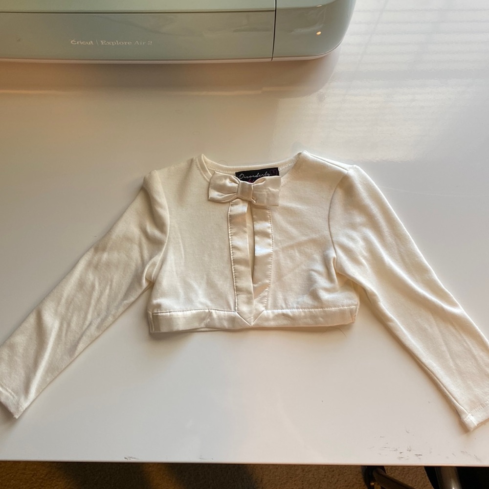 2T NWOT sweater shell.  Ivory with bow closure at top